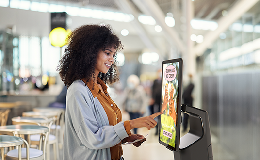 Women using a kiosk